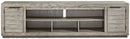 Naydell - XL TV Stand w/Fireplace Option - Gray